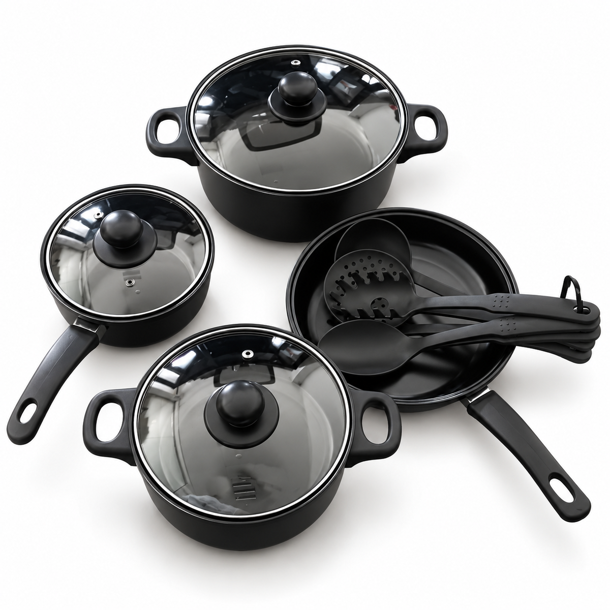 A 4-piece black nonstick cookware set on a white background, including two saucepans with glass lids, a small frying pan with utensils, and a stockpot with a glass lid.