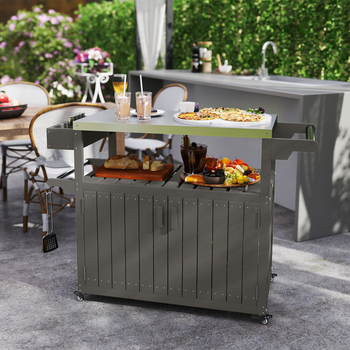 Outdoor kitchen cart with food and drinks on a patio