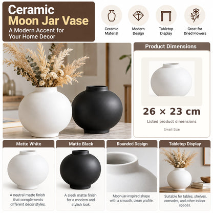 A promotional graphic for a ceramic moon jar vase showing two matte-finish vases, one matte white and one matte black, with dried flowers in the white vase. The layout includes feature callouts such as ceramic material, modern design, tabletop display, great for dried flowers, product dimensions 26 x 23 cm, matte white and matte black finishes, rounded design, and tabletop display.