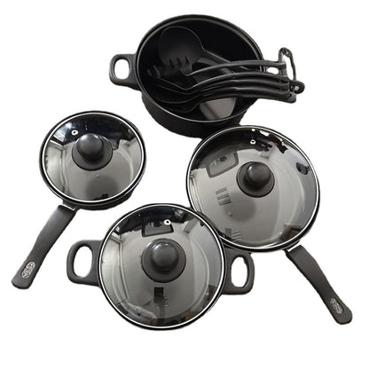 Set of black cookware with glass lids on a white background