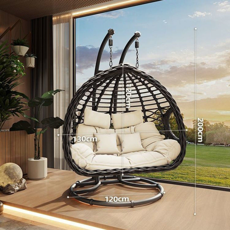 Hanging egg chair with dimensions displayed in a room with a large window showing a garden view.