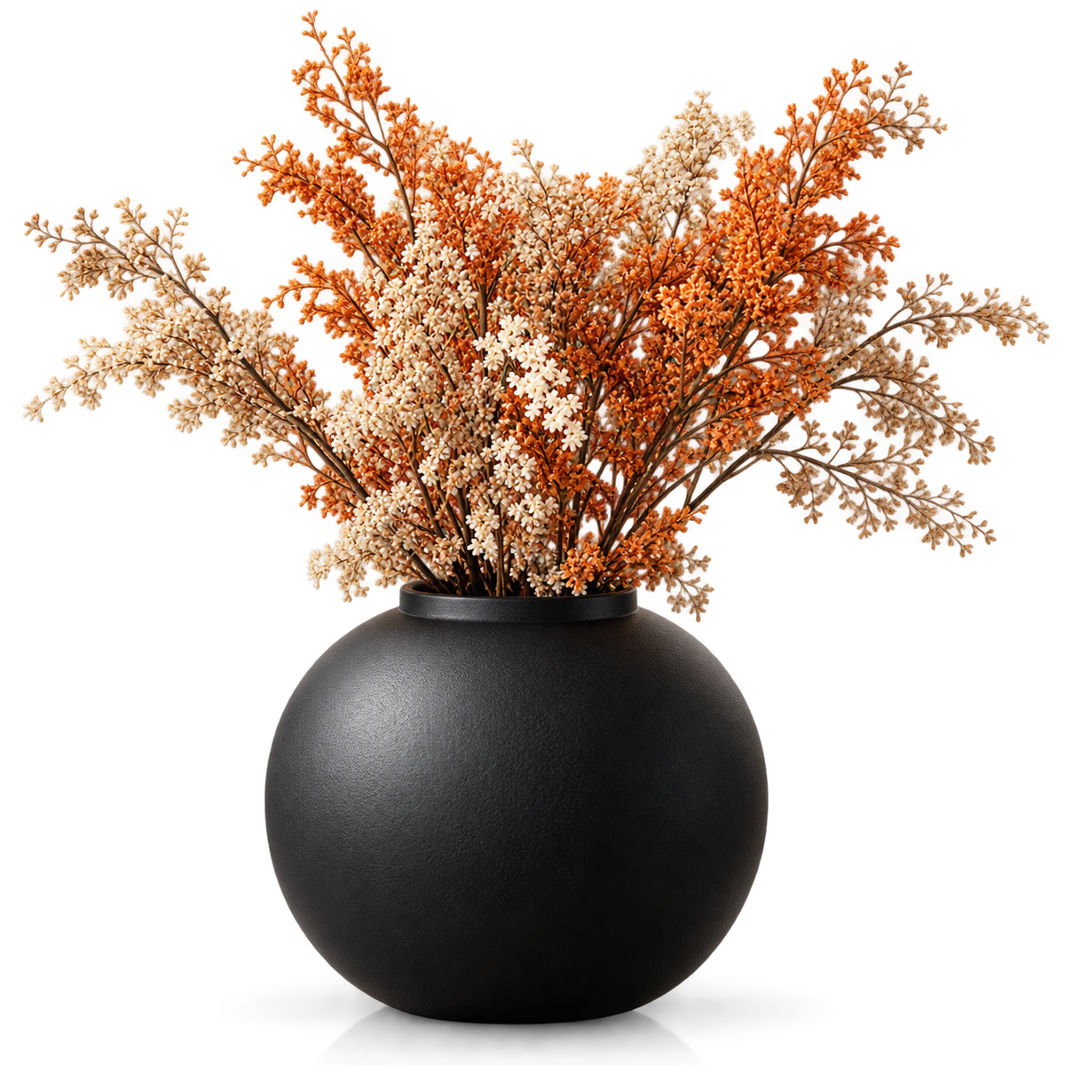 A matte black spherical vase filled with dried floral stems in orange, cream, and tan tones, photographed against a clean white background.