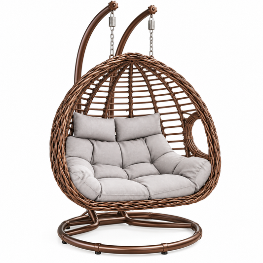 A brown woven rattan hanging egg chair with a light gray cushioned seat and backrest, suspended by chains from a matching round base, shown on a plain white background.