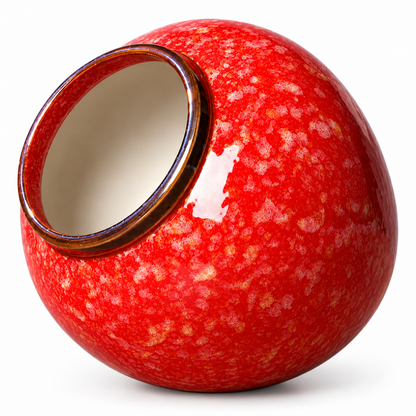 A glossy ceramic vase with a rounded, apple-like shape, featuring a vibrant red speckled glaze, a dark brown rim, and a cream-colored interior, shown on a white background.